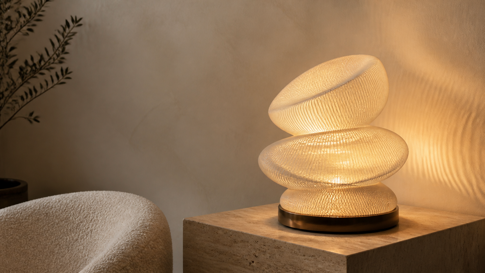 A sculptural LUM light glowing in a warm interior